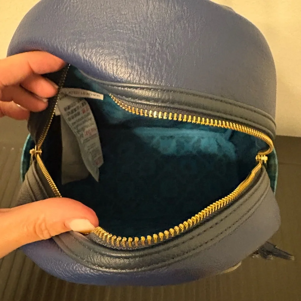 Loungefly Blue and Teal King Louie Glow In The Dark Mini Backpack